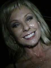 Hot blonde with huge tits gets covered in cum while in the theater