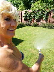 Horny blonde mature woman getting naughty in her garden